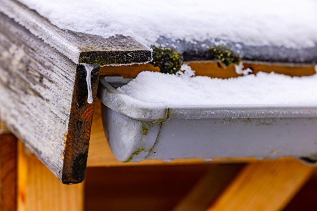 Winter gutter cleaning on a home in Salt Lake City, UT